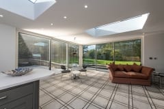 Luxury Home Extension with Large Glass Doors and Roof